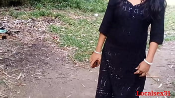 Busty Indian housewife engages in outdoor sex in black dress